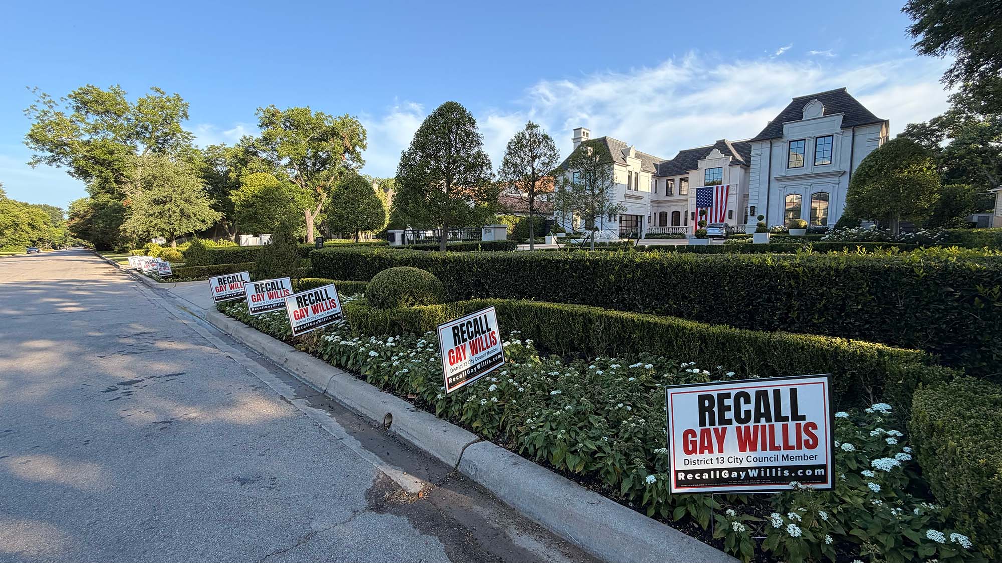 Recall Gay Willis yard signs lining a District 13 street